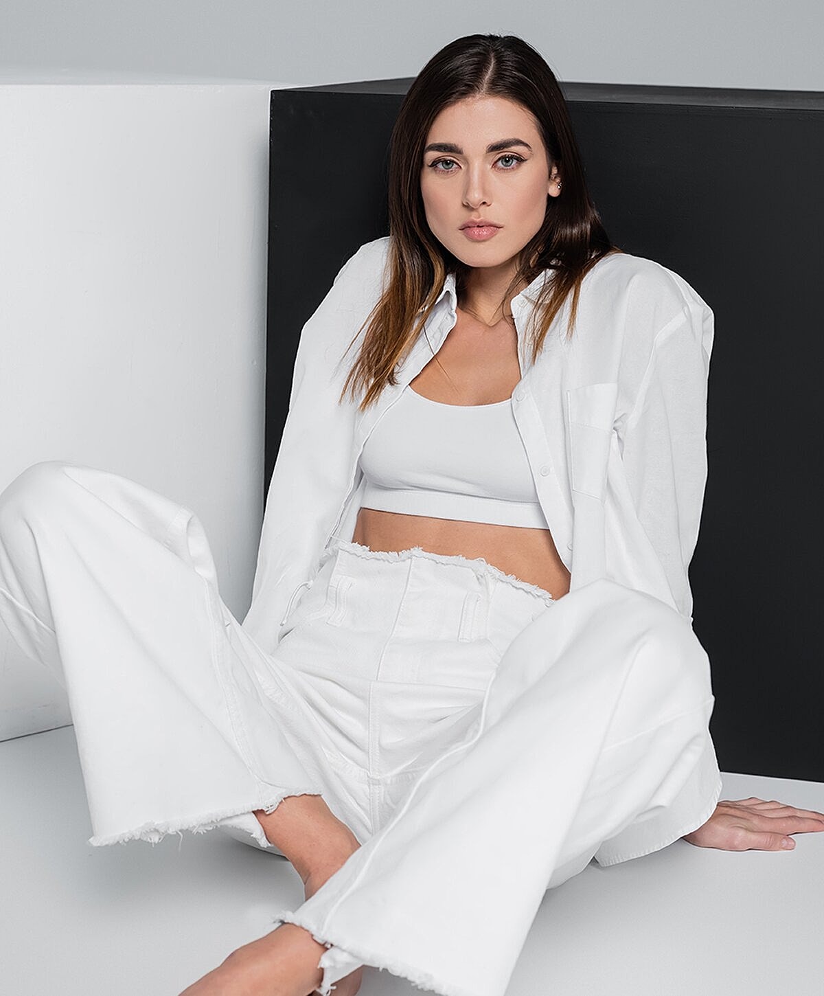 Modern seating area with blue chairs and greenery.