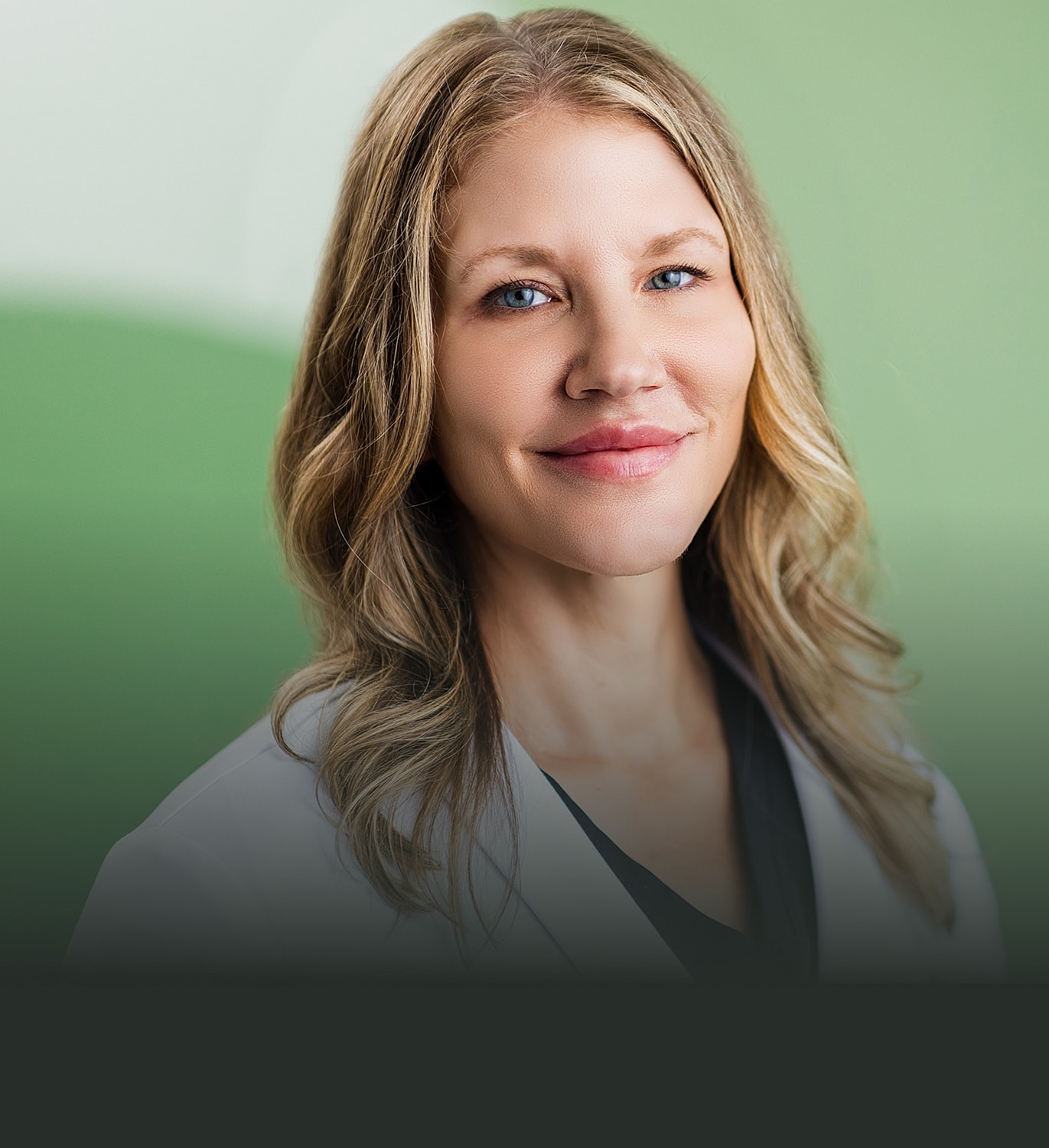 Female doctor smiling in professional setting.