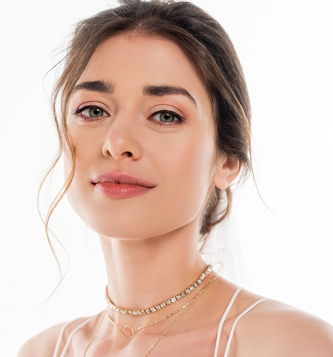 Portrait of a woman wearing elegant jewelry.