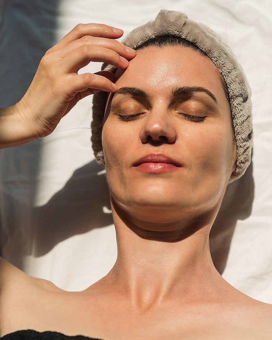 Smiling woman with long, wavy hair.