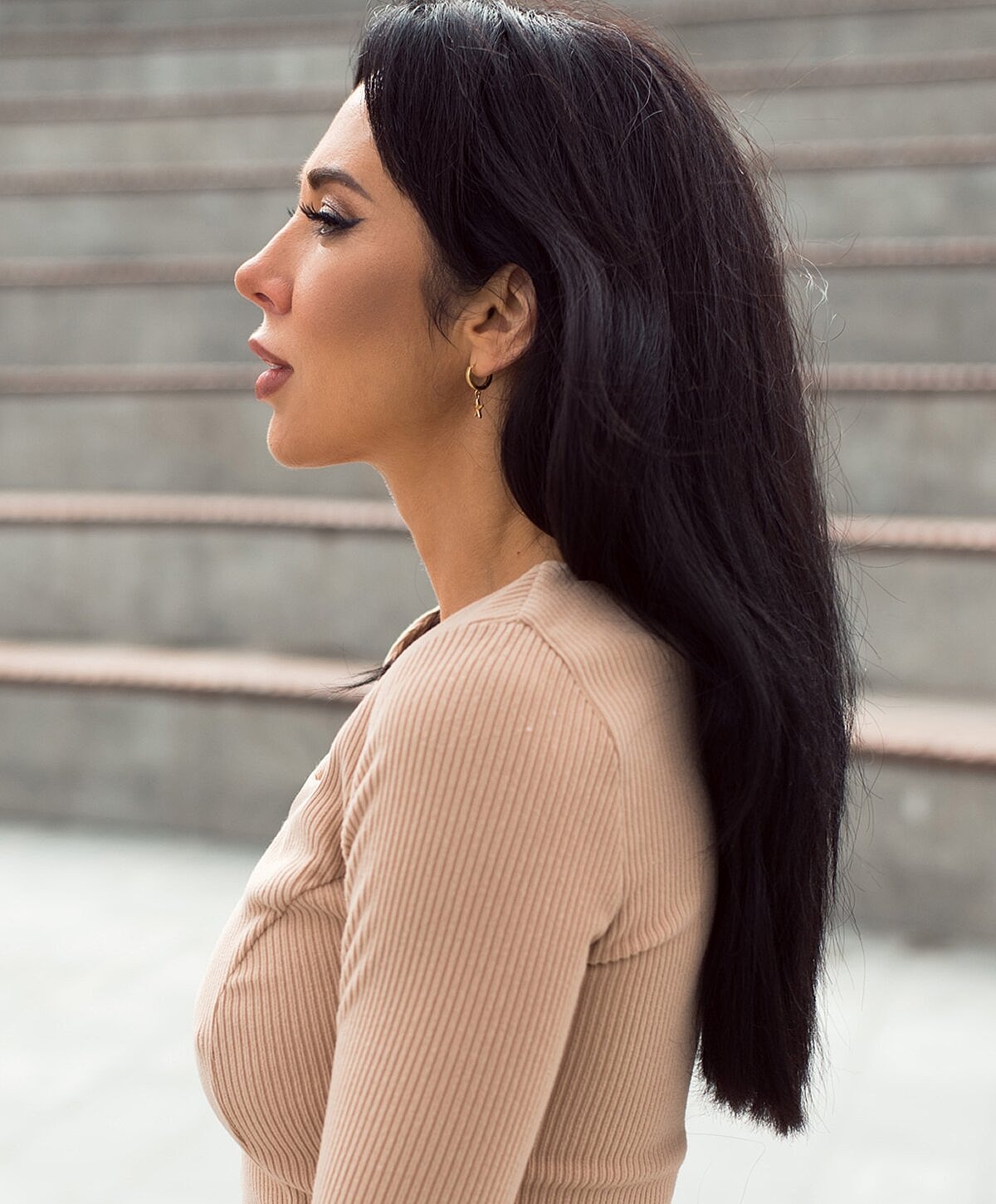 Modern seating area with blue chairs and greenery.